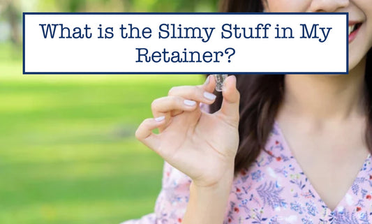 a girl holding a slimy retainer