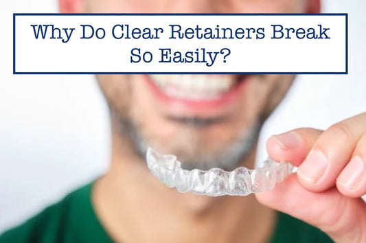 a smiling man holding a retainer