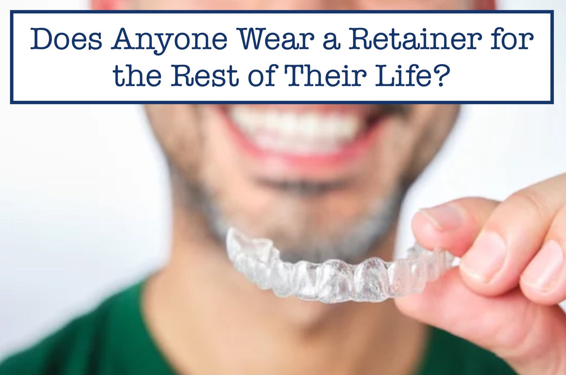 a man smiling while showing his plastic retainer 