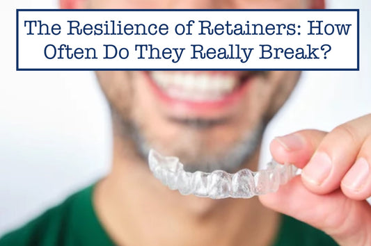 smiling while holding a retainer