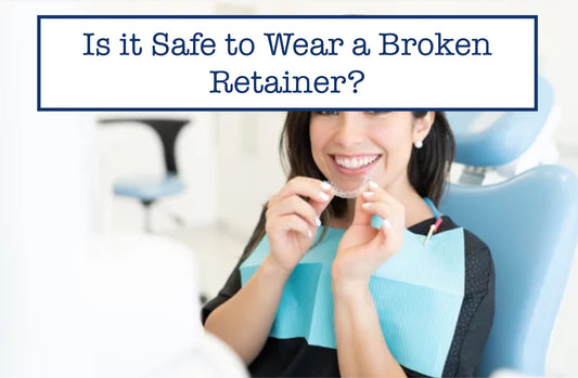 girl in a dental chair holding her retainer