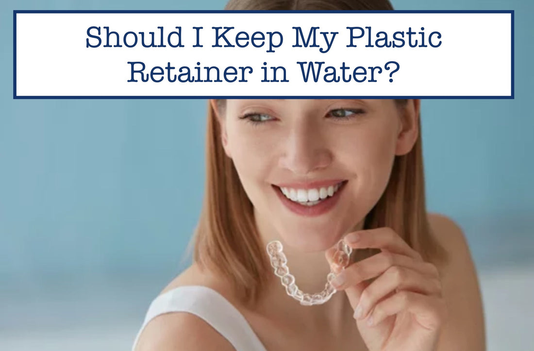 a girl smiling while holding a plastic retainer