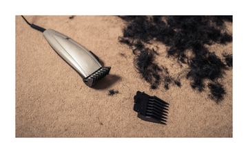 cut hair on floor with hair clipper